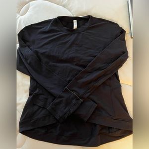 Lululemon, used like new. Thumbs holes, zip pocket in back, size Large.